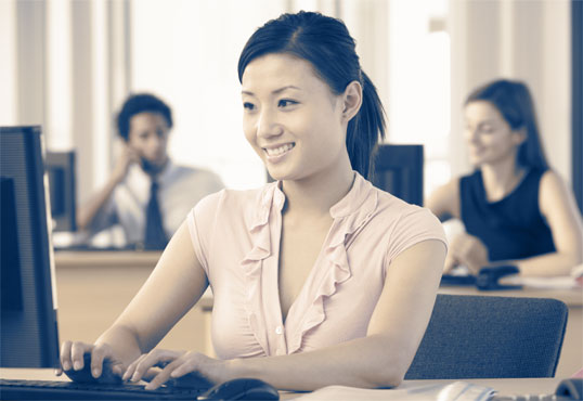 Young Asian business woman using a computer